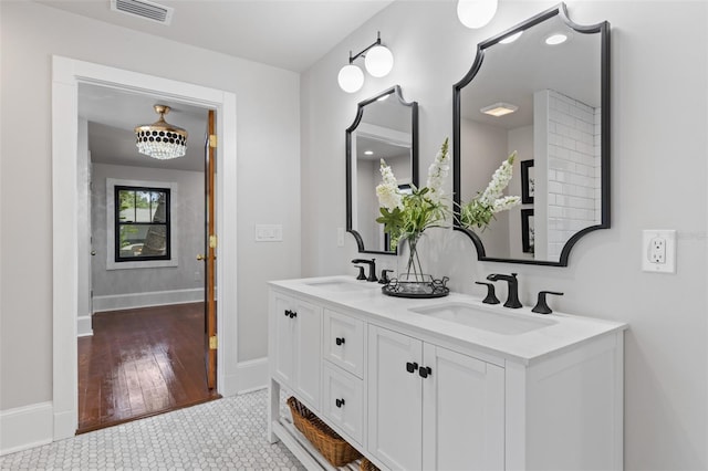 bathroom with tile patterned flooring and vanity