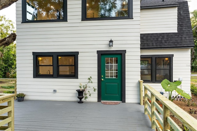 rear view of house with a wooden deck