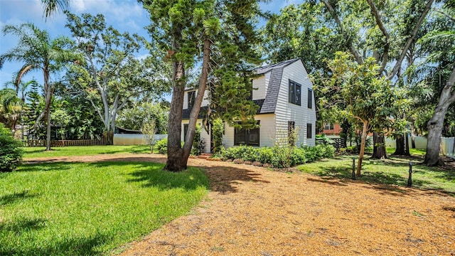 view of home's exterior featuring a yard