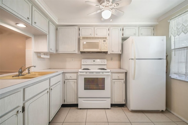 kitchen featuring white cabinetry, light tile patterned floors, white appliances, and sink