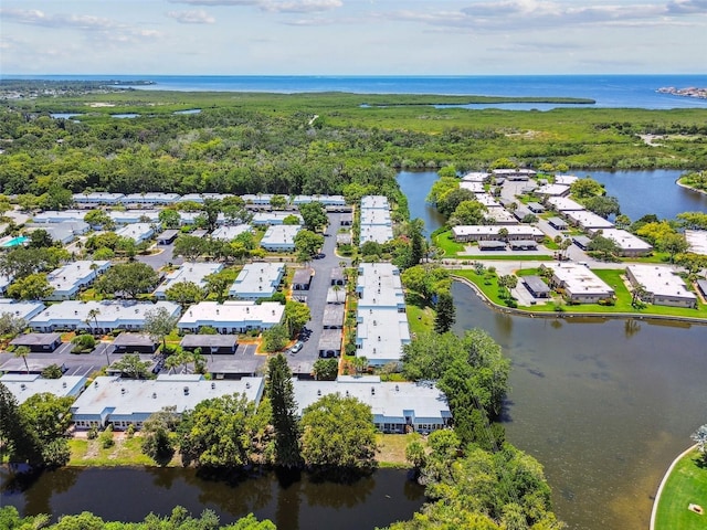 birds eye view of property featuring a water view