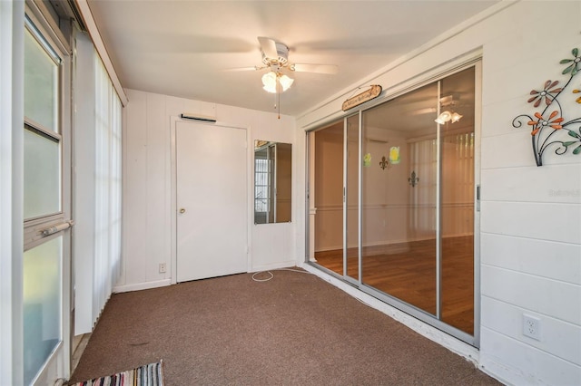 interior space featuring ceiling fan