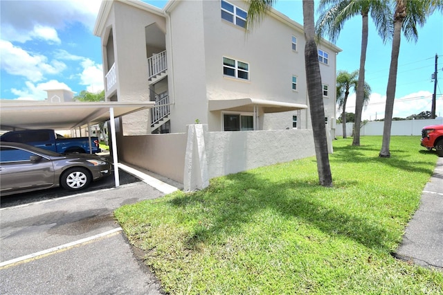 view of side of home featuring a yard