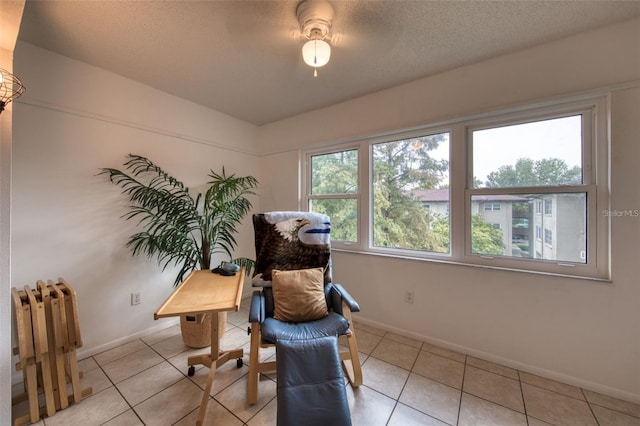 sitting room featuring light tile patterned floors and radiator heating unit