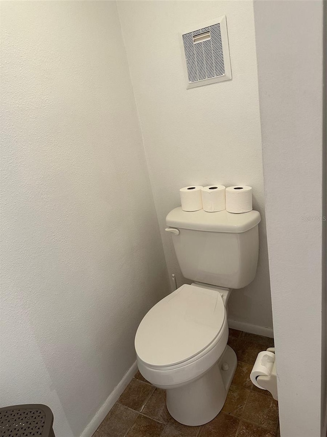 bathroom featuring toilet