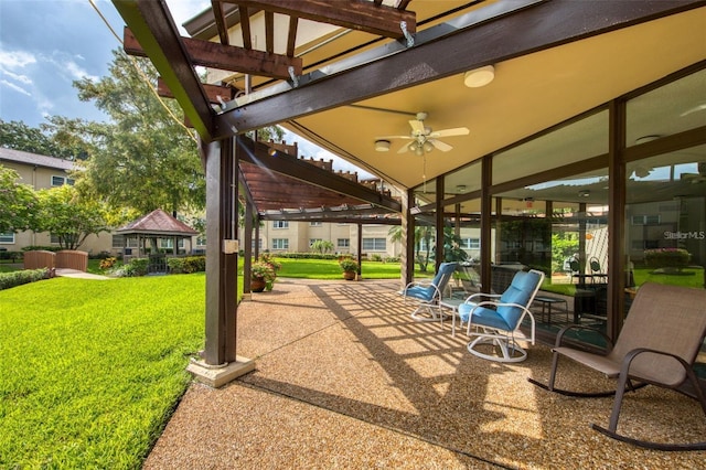 view of patio featuring ceiling fan and a pergola