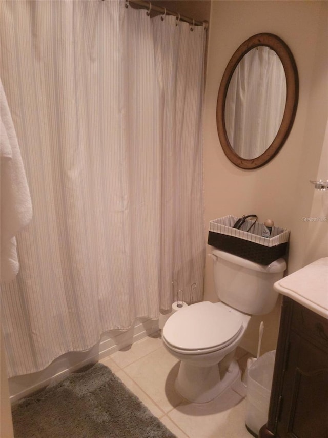 bathroom with vanity, tile patterned floors, and toilet