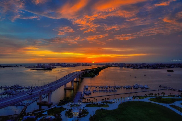 aerial view at dusk with a water view