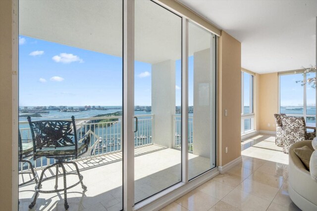 balcony featuring a water view