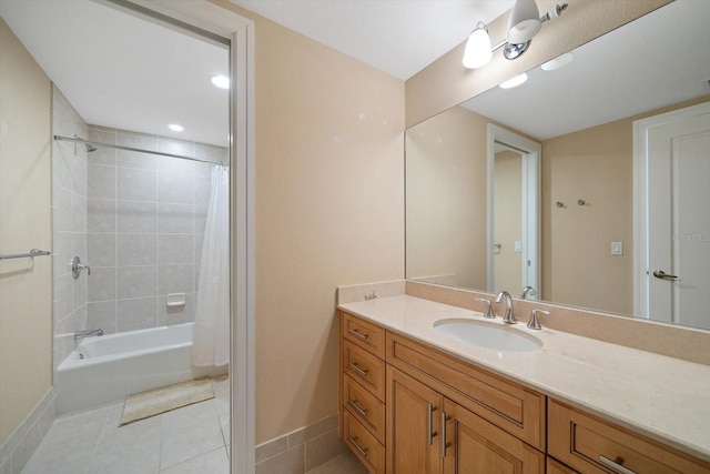 bathroom with shower / tub combo, vanity, baseboards, and tile patterned floors