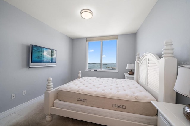 carpeted bedroom with baseboards