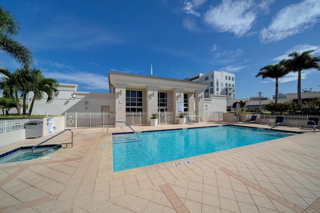 pool with fence and a patio