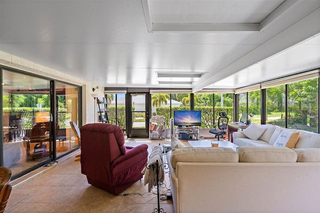 sunroom featuring a tray ceiling