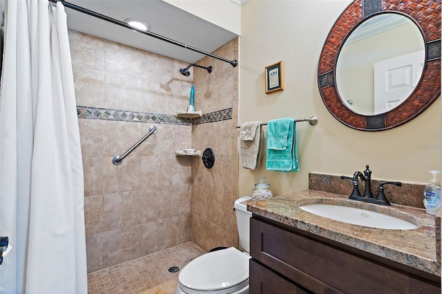 bathroom with vanity, toilet, and curtained shower