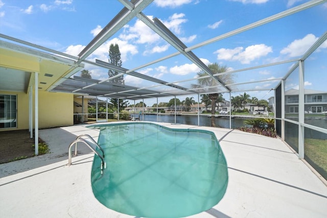 view of pool with a water view, a patio area, and a lanai