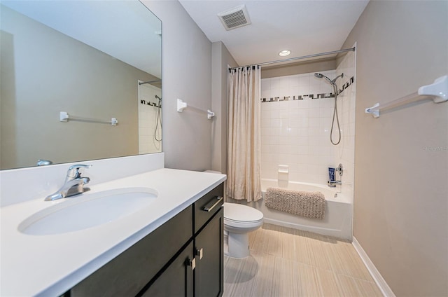 full bathroom with vanity, shower / bath combo, and toilet