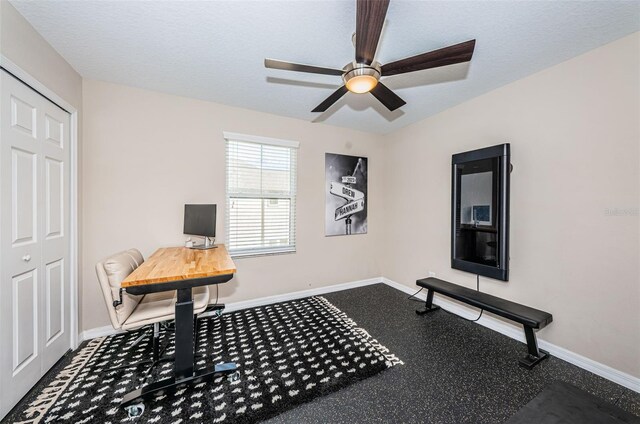 office space with ceiling fan and a textured ceiling