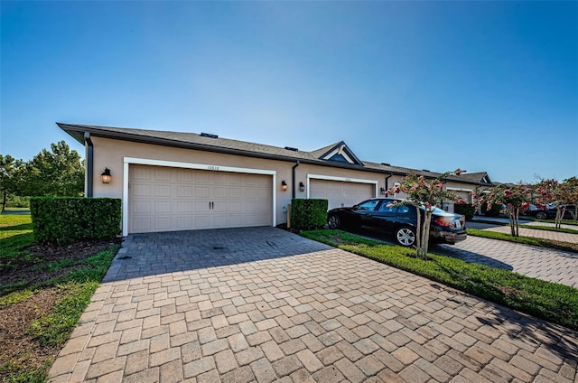 ranch-style house featuring a garage