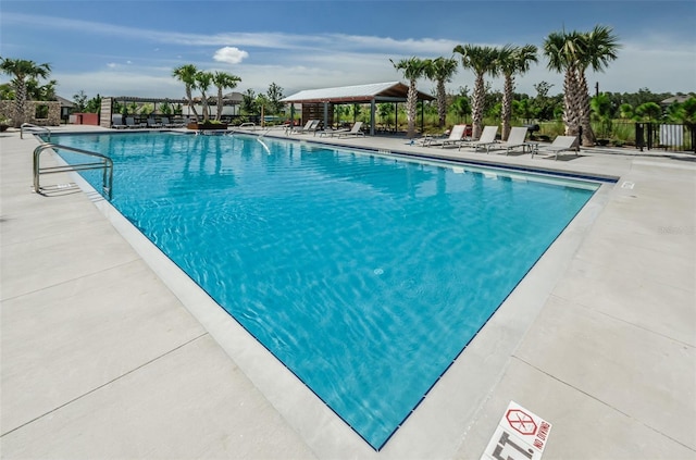 view of swimming pool featuring a patio area