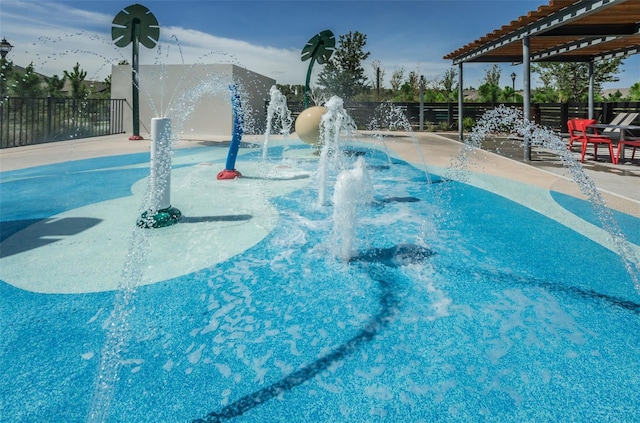 view of pool featuring pool water feature