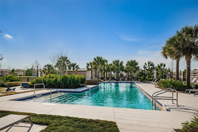 view of swimming pool featuring a patio area