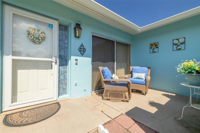 property entrance with a patio