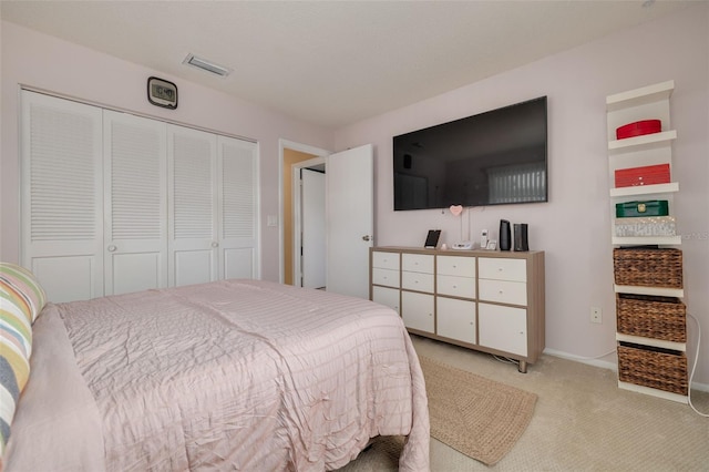 carpeted bedroom featuring a closet