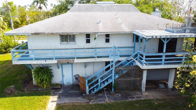 rear view of property with a wooden deck