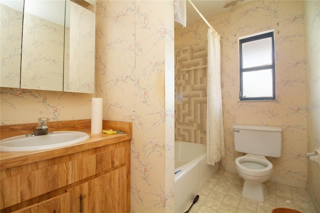 full bathroom with vanity, shower / tub combo, and toilet