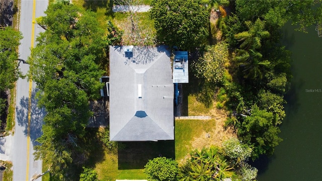 birds eye view of property with a water view