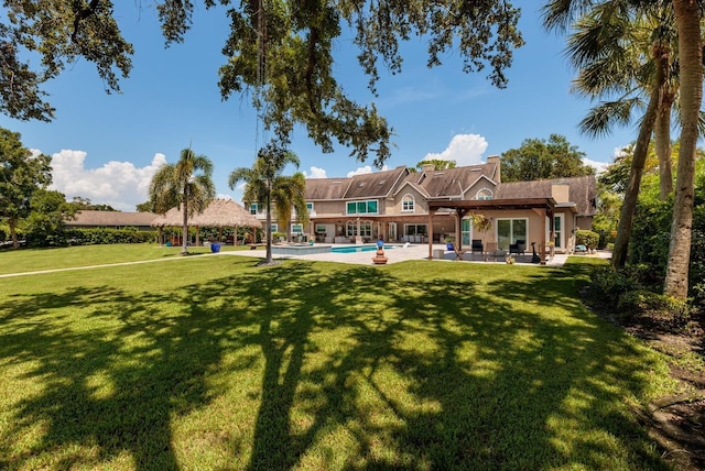 exterior space with a patio and a lawn