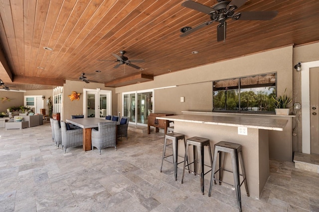 view of patio / terrace featuring outdoor lounge area and an outdoor bar