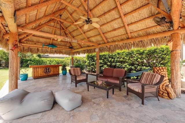 view of patio / terrace with outdoor lounge area, a gazebo, and ceiling fan