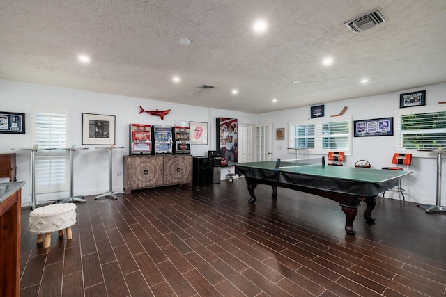 recreation room featuring a textured ceiling and pool table