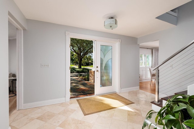 doorway to outside featuring light tile patterned floors