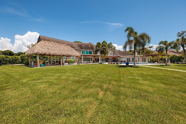 view of home's community with a gazebo and a yard