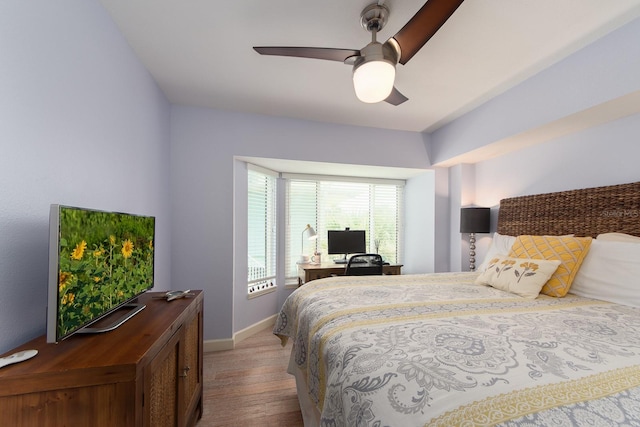 bedroom with light wood-type flooring and ceiling fan