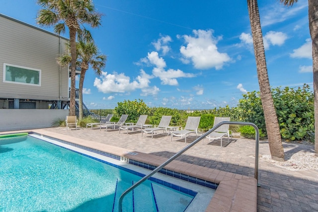 view of swimming pool featuring a patio