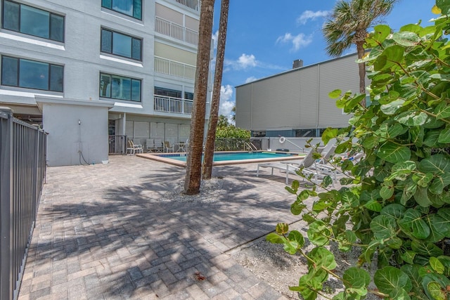 view of patio / terrace featuring a community pool