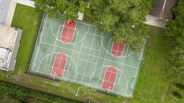 view of basketball court featuring a lawn