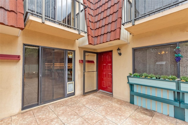 doorway to property featuring a patio