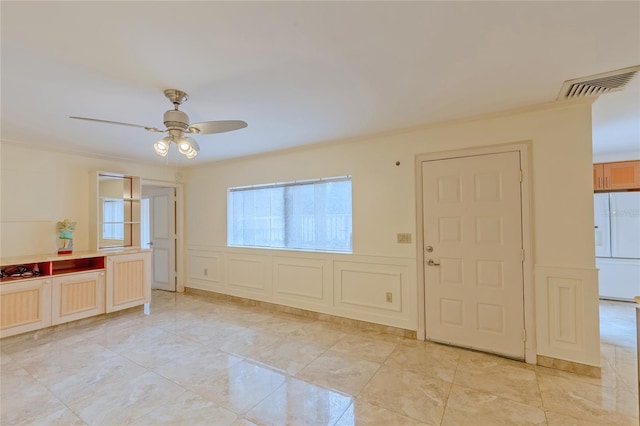 tiled empty room with ceiling fan