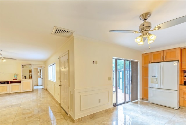 interior space featuring light tile patterned flooring, crown molding, ceiling fan, and white fridge with ice dispenser