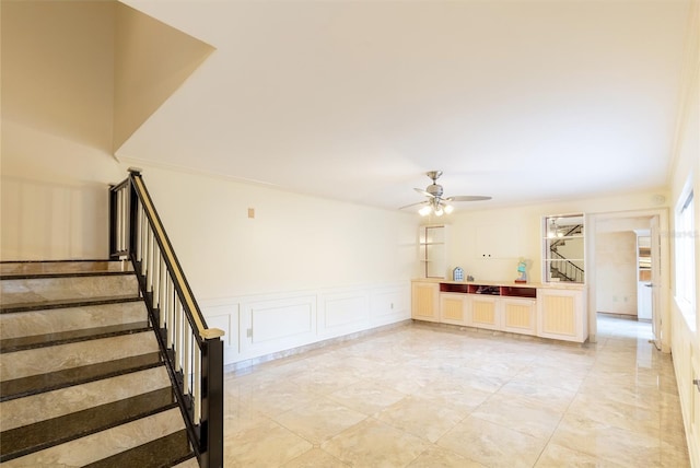 interior space featuring light tile patterned floors and ceiling fan