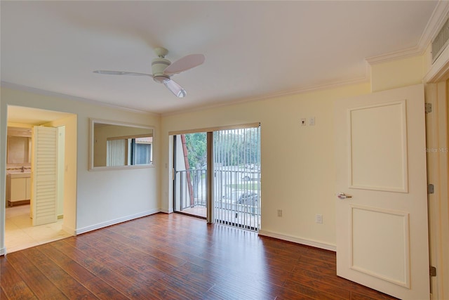 spare room featuring ceiling fan, sink, hardwood / wood-style flooring, and ornamental molding