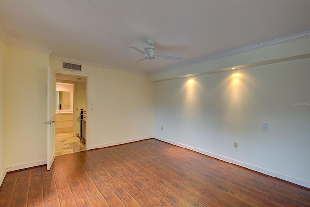 tiled empty room featuring ornamental molding and ceiling fan