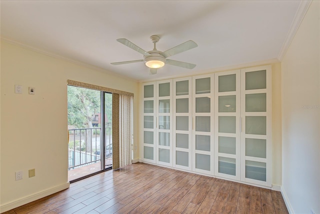 spare room with ornamental molding, ceiling fan, and hardwood / wood-style floors