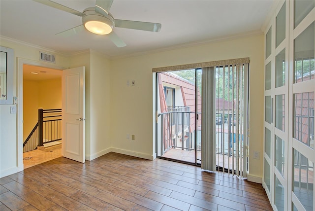 unfurnished room featuring ceiling fan, hardwood / wood-style floors, and crown molding