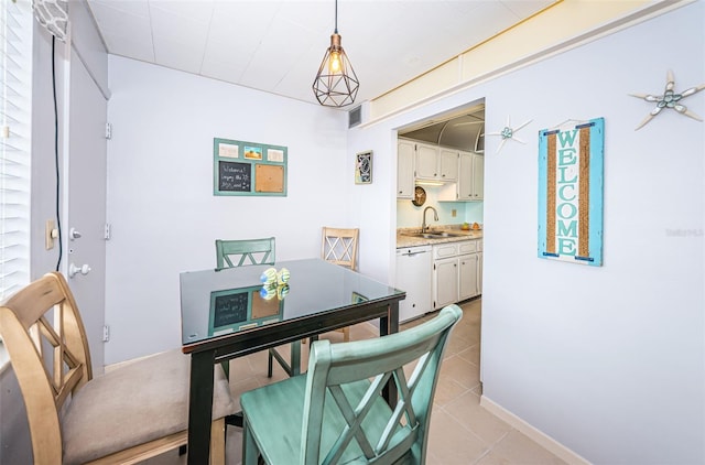 tiled dining room with sink