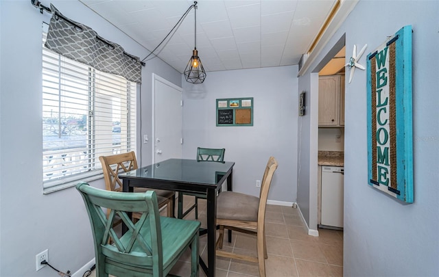 dining area featuring light tile patterned flooring